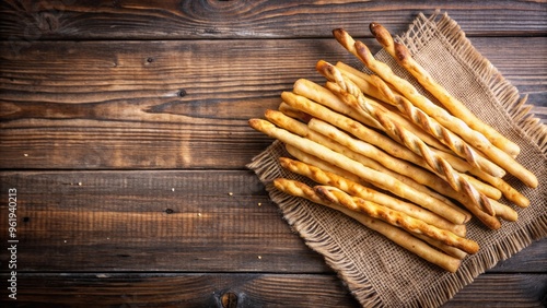 Crunchy and golden breadsticks on a rustic wooden table, snack, Italian, crunchy, grissini, appetizer, olive oil, baked, savory