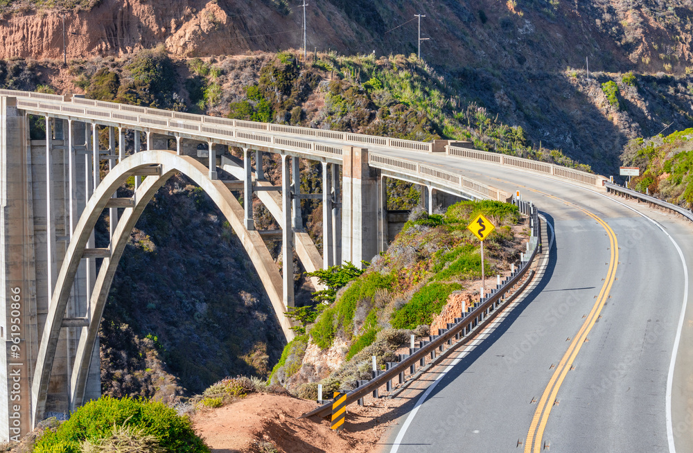 Beautiful scenery of Pacific Ocean coast along Highway 1 and Big Sur, wonderful aerial view of Bixby Bridge, sunset, sunrise, fog. Concept, travel, vacation, weekend Beautiful scenery of Pacific Ocean coast along Highway 1 and Big Sur, wonderful aerial view of Bixby Bridge, sunset, sunrise, fog. Concept, travel, vacation, weekend