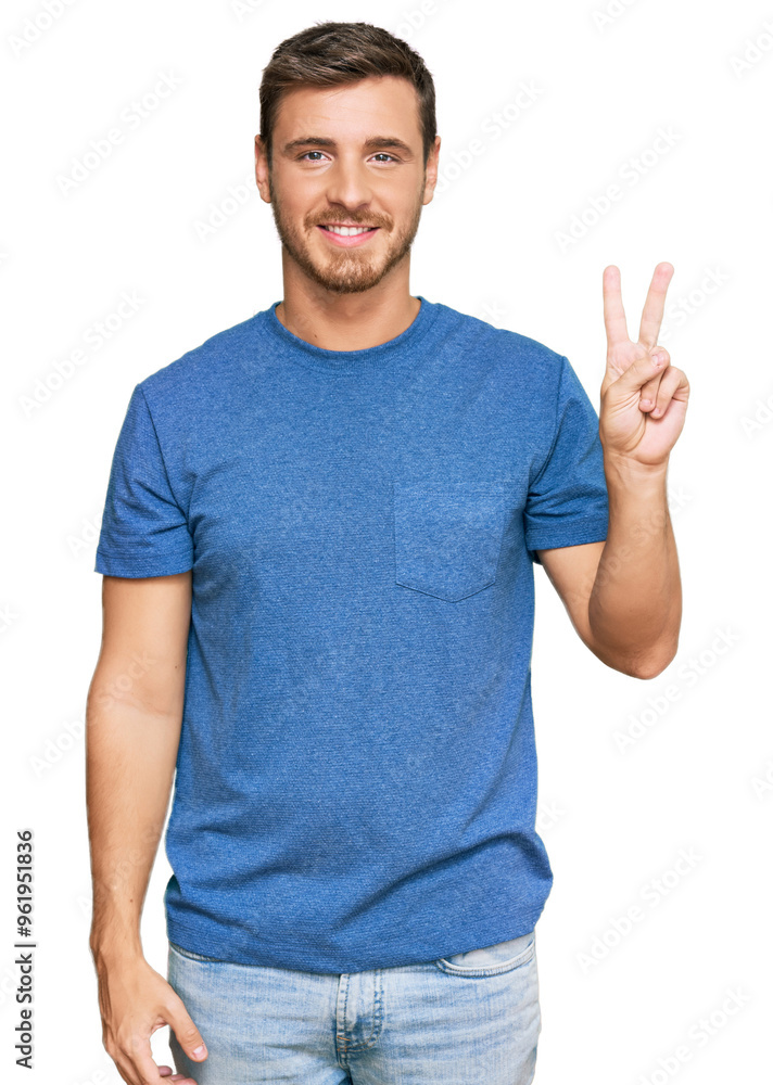 Naklejka premium Handsome caucasian man wearing casual clothes showing and pointing up with fingers number two while smiling confident and happy.