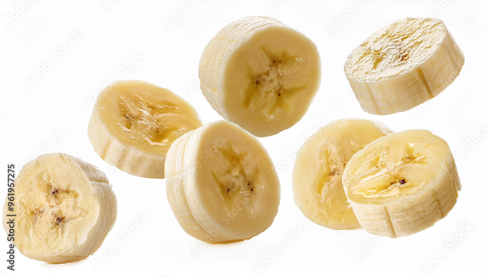 several banana slices falling on a white background, full field several banana slices falling on a white background, full field