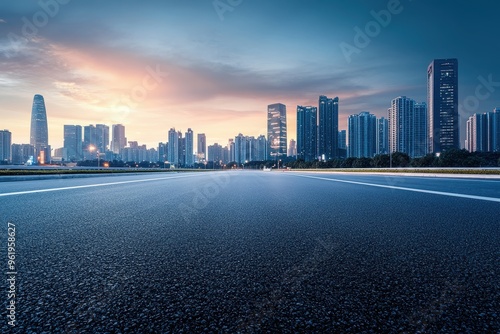 Urban city skyline with asphalt road at twilight