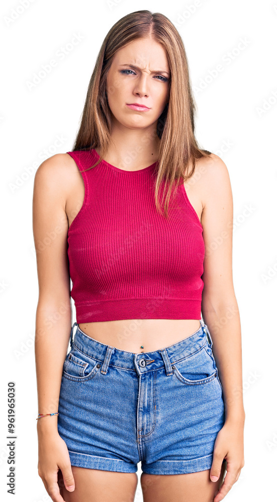 Young beautiful blonde woman wearing elegant summer shirt skeptic and nervous, frowning upset because of problem. negative person. Young beautiful blonde woman wearing elegant summer shirt skeptic and nervous, frowning upset because of problem. negative person.