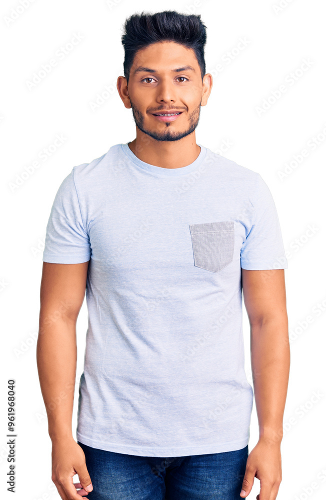 Fototapeta premium Handsome latin american young man wearing casual clothes with a happy and cool smile on face. lucky person.