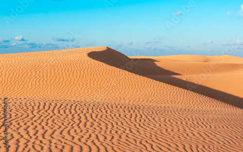 Desert sand pattern during the day light. wave sand parttern of the desert isolated. photo