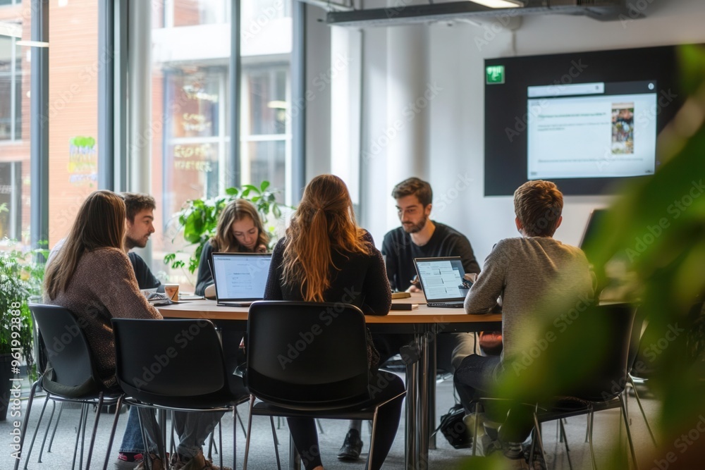 Group discussion in a modern co-working space, group discussion, collaborative learning environment