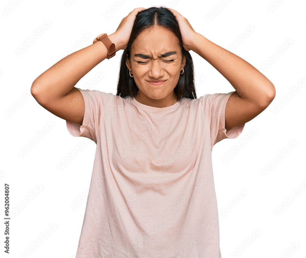 Young asian woman wearing casual clothes suffering from headache desperate and stressed because pain and migraine. hands on head. Young asian woman wearing casual clothes suffering from headache desperate and stressed because pain and migraine. hands on head.