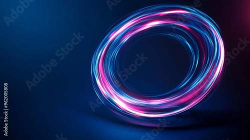 A swirling circle of blue and pink light streaks across a dark blue background. The circle seems to be moving quickly, creating a blurry effect.