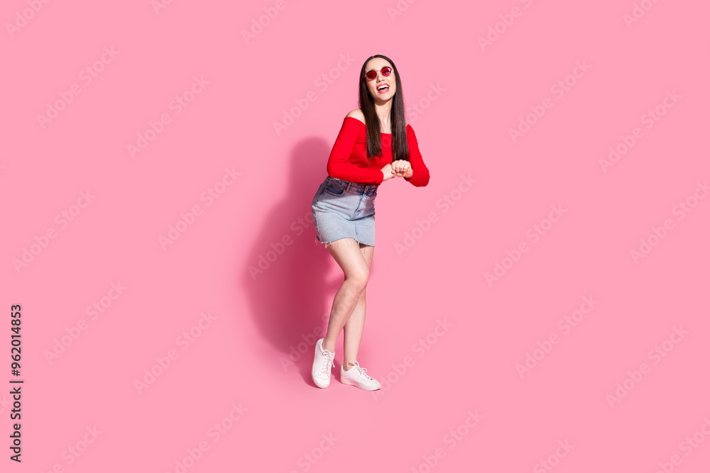 Full body portrait of pretty young girl dance rejoice isolated on pink color background Full body portrait of pretty young girl dance rejoice isolated on pink color background