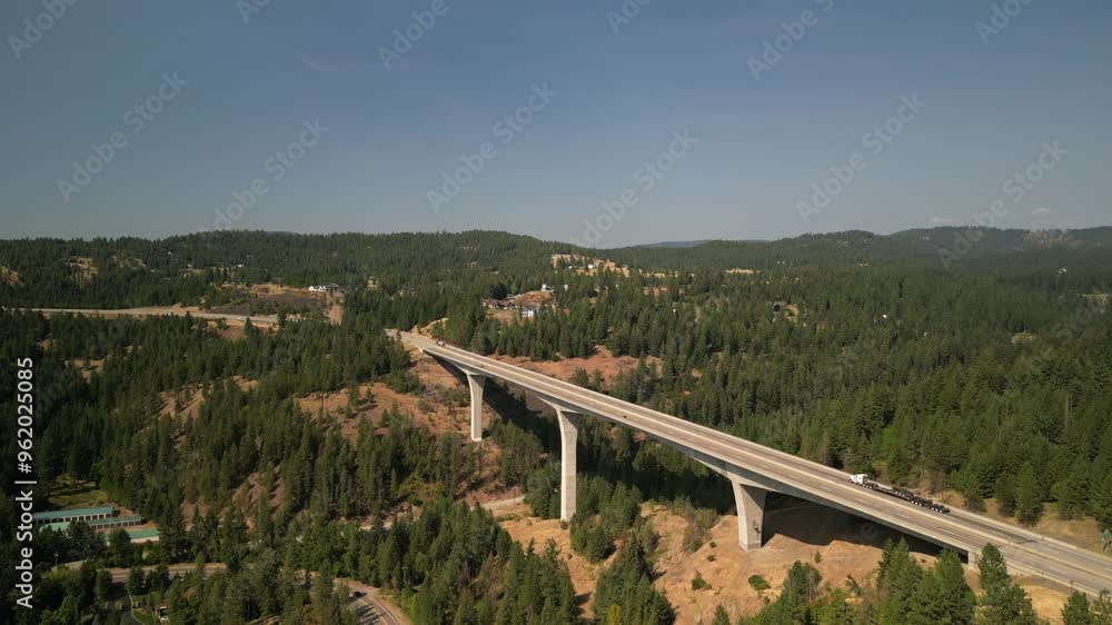 Aerial over bridge on Highway 90 through Coeur Dalene Idaho in summer in forested hills Aerial over bridge on Highway 90 through Coeur Dalene Idaho in summer in forested hills