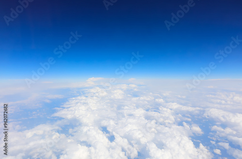 Canvas Print aerial view of white clouds and blue sky from an airliner from above