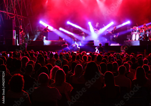 Tablou pe pânză people in the audience spectators during the concert and the band on stage