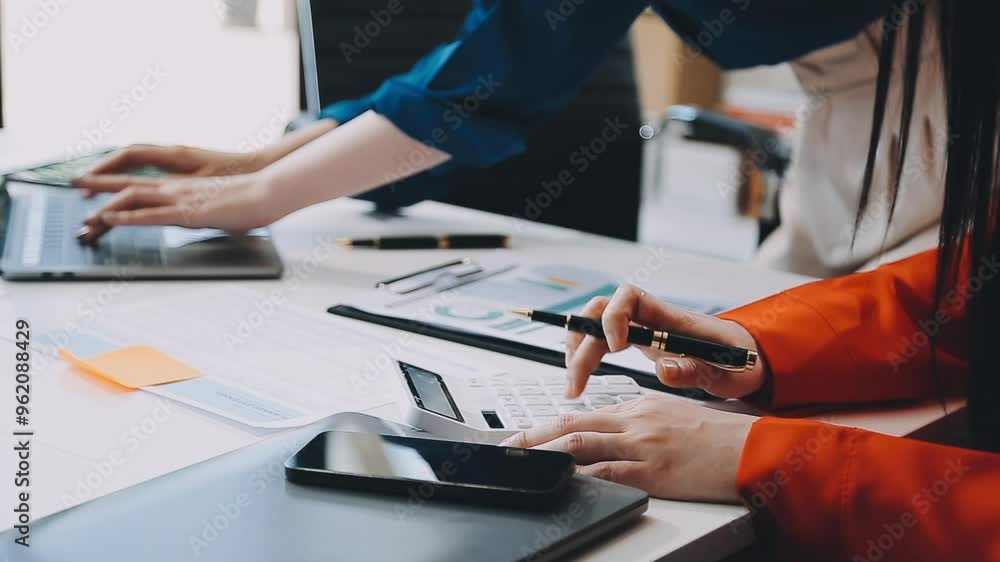Close up of marketing manager employee pointing at business document,Brainstorming stock market investment plans,With statistical data showing profits and income teamwork concept. Close up of marketing manager employee pointing at business document,Brainstorming stock market investment plans,With statistical data showing profits and income teamwork concept.