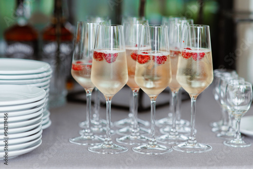 glasses champagne, welcome drink, wine glass, cocktail, with raspberry, Sparkling wine,celebrate a luxury party, Catering, party service,