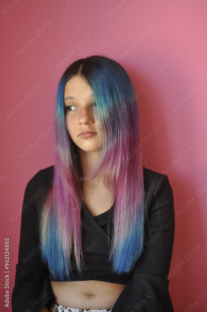 Fototapeta premium Girl with Long Colorful Hair Dyed in Horizontal Blue, Purple, and Pink Stripes
