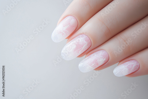 Female hand with pink nails. Female manicure with long nails, woman showing fresh perfect manicure with pink nail polish, gel nails made at luxury beauty salon