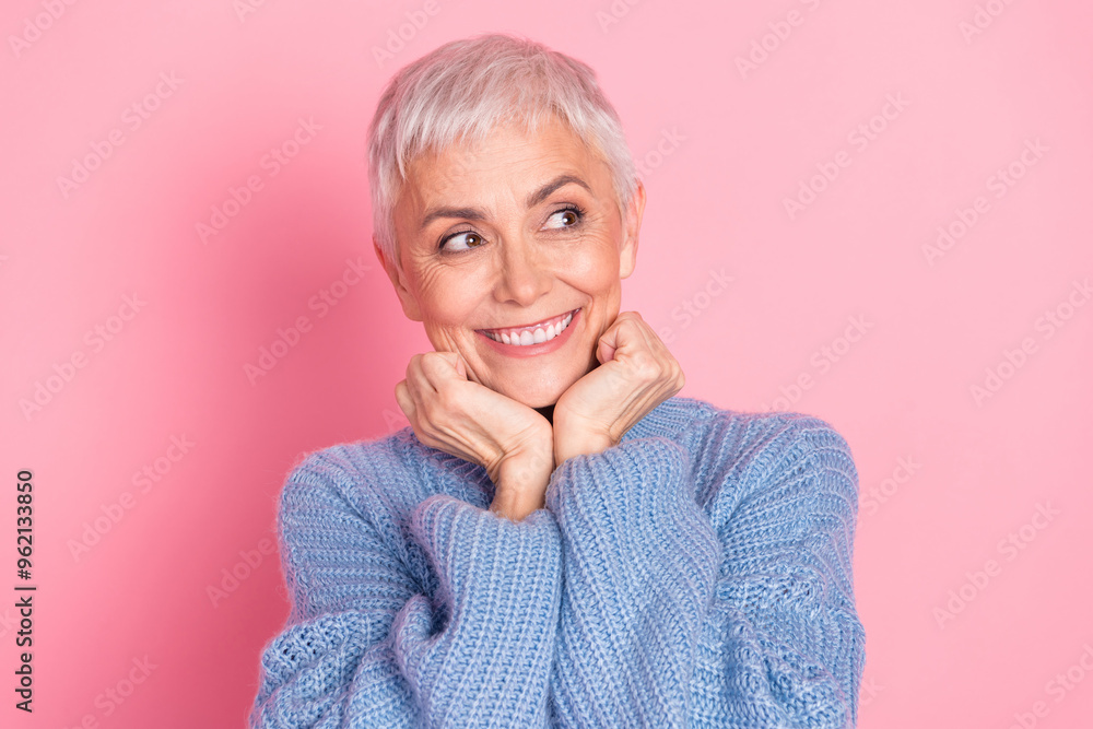 Photo portrait of pretty retired female dreamy look empty space wear trendy blue knitwear outfit isolated on pink color background Photo portrait of pretty retired female dreamy look empty space wear trendy blue knitwear outfit isolated on pink color background