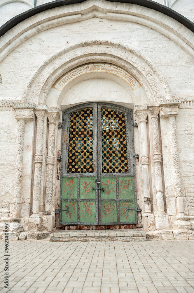 Ornate door on an ancient church with historical architecture Ornate door on an ancient church with historical architecture