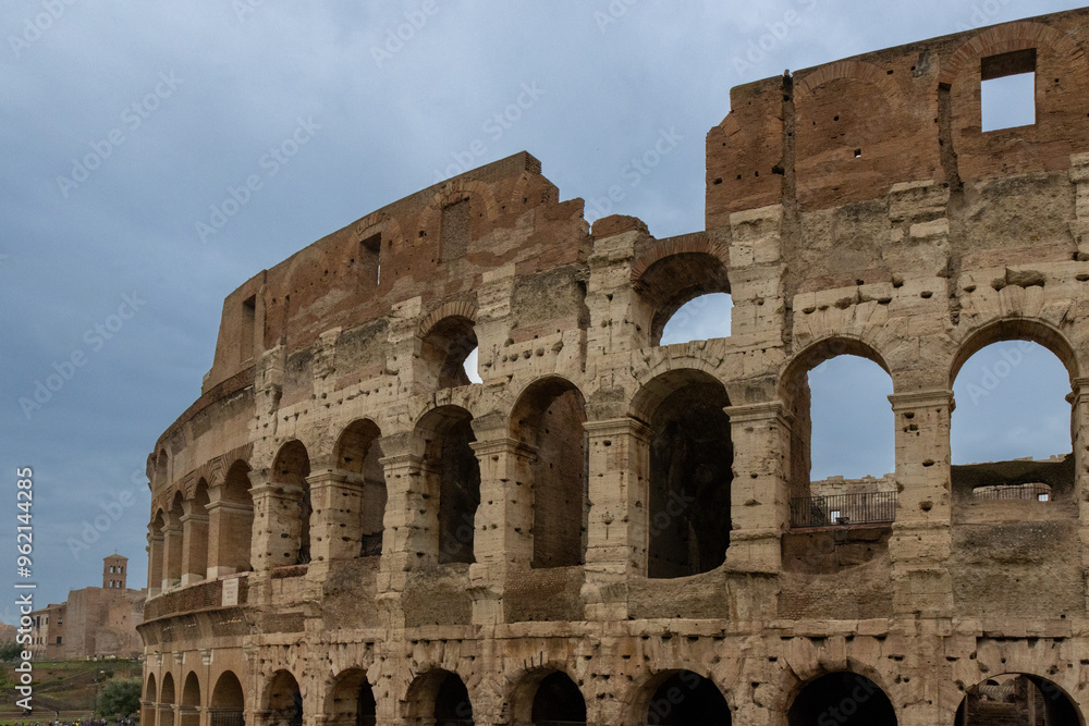 Roman Colosseum, the largest ancient amphitheatre ever built, Italy. Arches, exterior facade. Rome, Italy Roman Colosseum, the largest ancient amphitheatre ever built, Italy. Arches, exterior facade. Rome, Italy