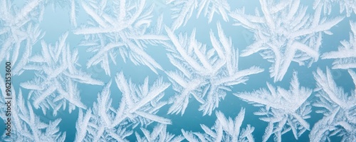 Icy rain creating patterns on a window, freezing weather, cold and wet