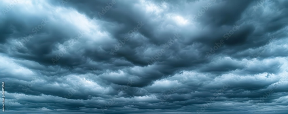 Overcast sky with dark clouds threatening rain, gloomy weather, moody atmosphere Overcast sky with dark clouds threatening rain, gloomy weather, moody atmosphere