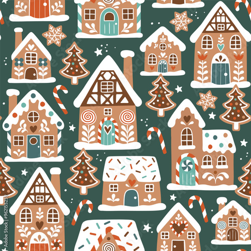 Seamless vector pattern with cute gingerbread houses and cookies. Hand drawn Christmas gingerbread village. EPS 10 vector file. Perfect for textile, wallpaper or print design.