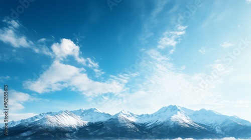 Wallpaper Mural Snowy mountain peaks under a clear blue sky with white clouds. Torontodigital.ca