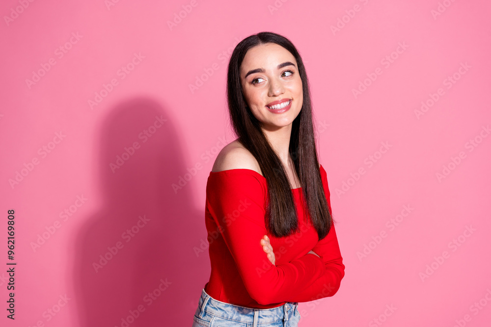 Portrait of pretty young girl folded arms look empty space red top isolated on pink color background Portrait of pretty young girl folded arms look empty space red top isolated on pink color background