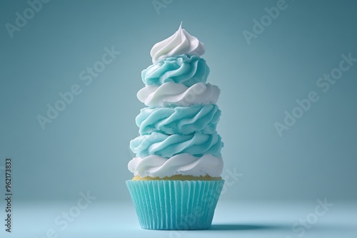 Whimsical blue white swirled cupcake on pastel background photo