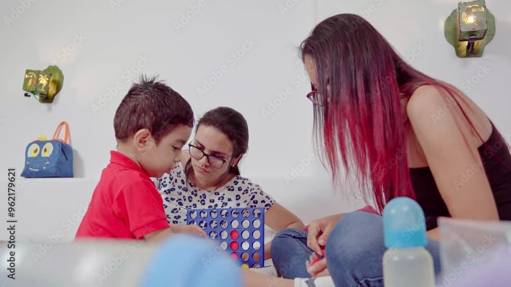 Mother playing with her son and aunt