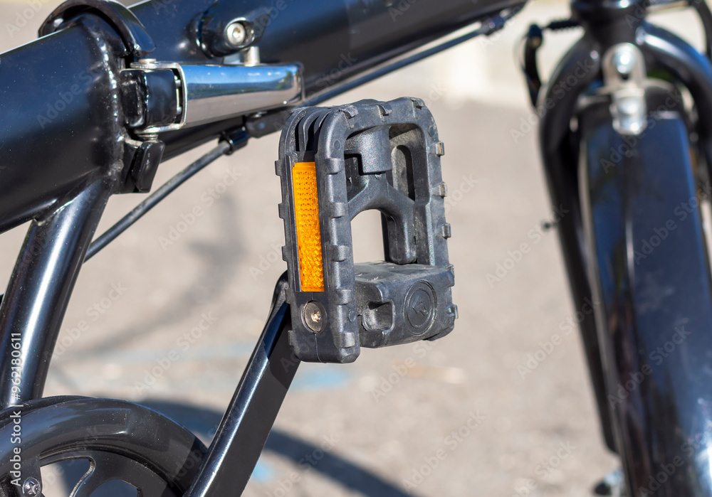 Folding bicycle pedal. Close-up. Folding bicycle pedal mechanism. Convenient bike storage Folding bicycle pedal. Close-up. Folding bicycle pedal mechanism. Convenient bike storage