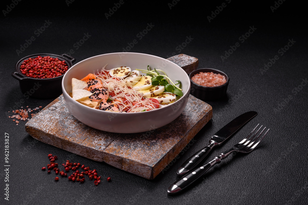 Delicious fresh caesar salad with salmon, lettuce, tomatoes and egg Delicious fresh caesar salad with salmon, lettuce, tomatoes and egg