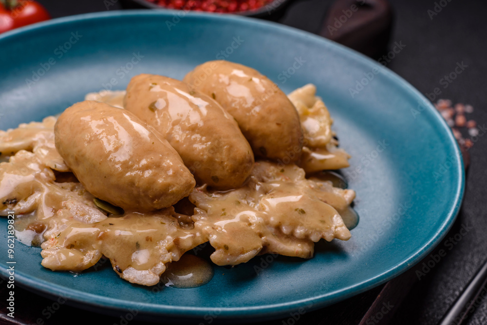 Fish or meat quenelles with delicate mushroom sauce, salt and spices Fish or meat quenelles with delicate mushroom sauce, salt and spices