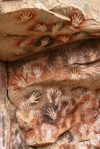 Ancient rock art at Cueva de Las Manos ( Cave of the Hands ) in Santa Cruz Province, Patagonia, Argentina. The art in the cave dates from 9,0001 to 13,000 years ago.