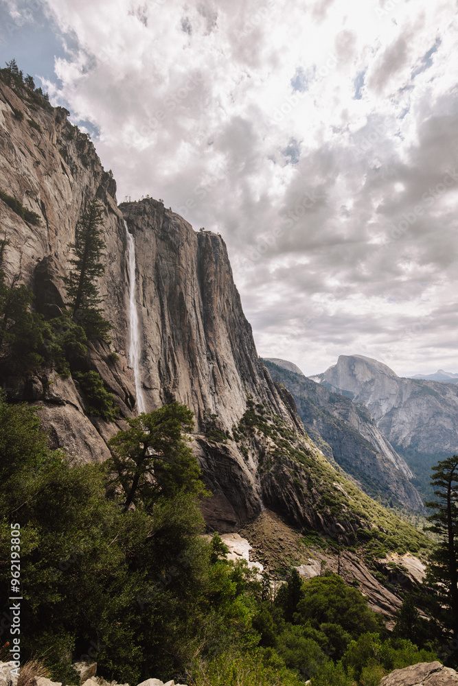 Upper Yosemite Falls with a view of Half Dome in Yosemite Upper Yosemite Falls with a view of Half Dome in Yosemite