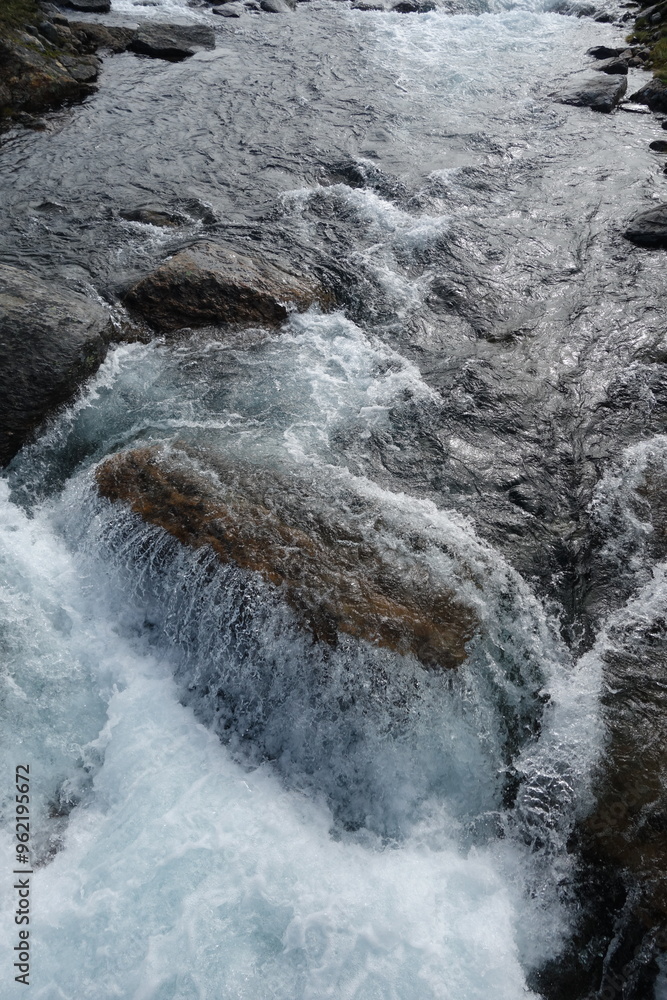 water runs over a rock
