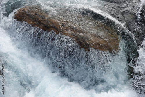 water runs over a rock