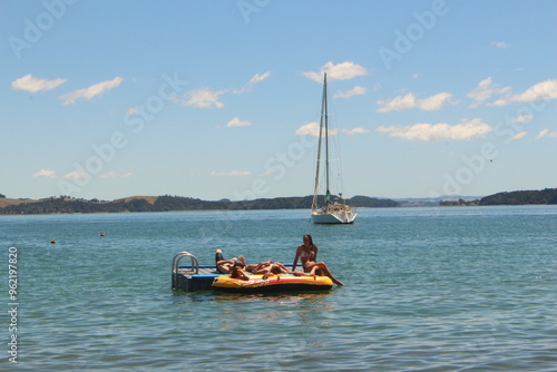 Friends hanging out at the beach in New Zealand