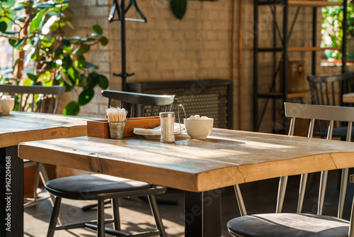 Canvas Print The aesthetic COZY appearance of an empty cafe with wooden furniture and minimalism