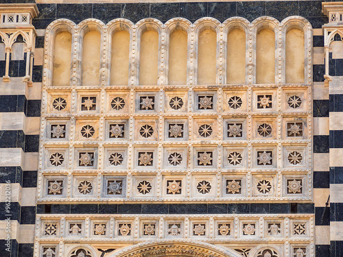 Detail of the facade of Monza Cathedral, with its rich marble decorations photo