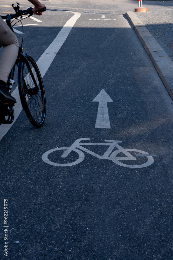 Obraz premium Pictogram for cycle superhighway painted on the road. Lane for cycling and a cyclist
