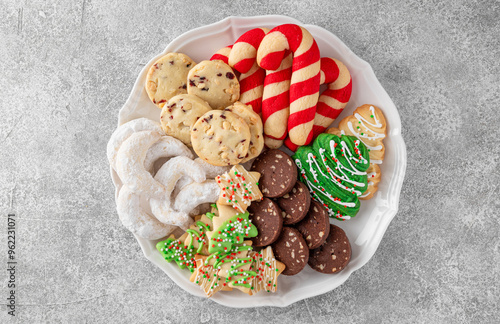 Canvas Print A plate with assorted homemade Christmas cookies on a gray concrete background