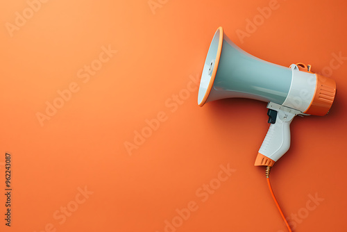 Electronic megaphone on color background