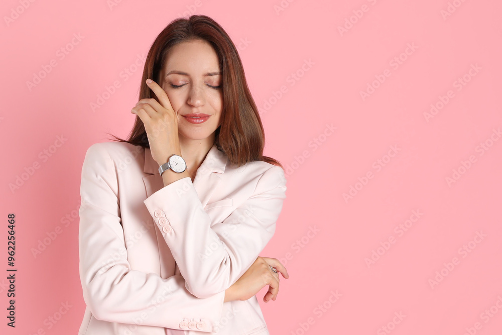 Beautiful woman in stylish white suit and watch on pink background, space for text Beautiful woman in stylish white suit and watch on pink background, space for text
