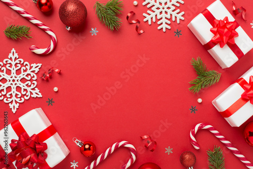 Christmas decor, gift boxes and confetti on color background, top view. Copy space for design