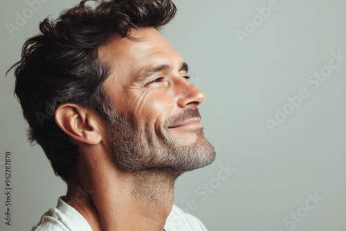 a close up of a smiling man's face