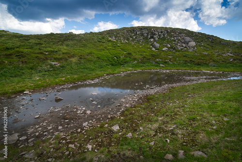 a small lake Niavchyn Persten, view from the north towards the peak of Pip-Iv...