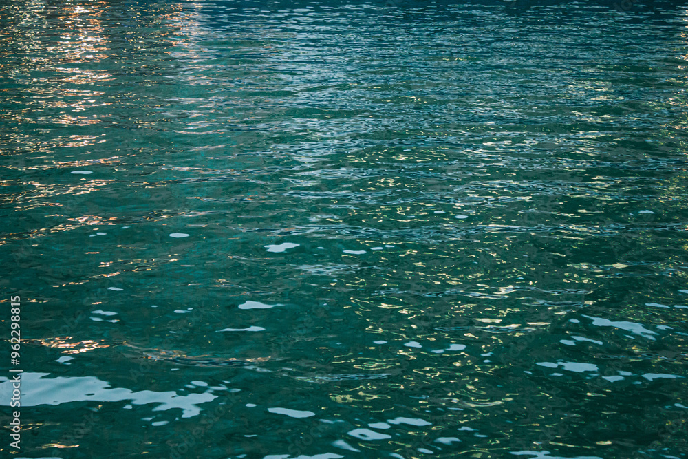 Sunlight Reflections on Calm Blue Water Surface
Sunlight Reflections on Calm Blue Water Surface