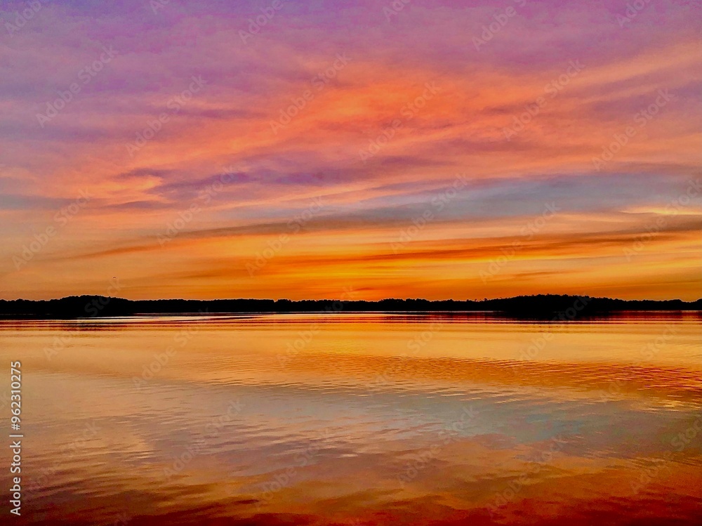 Colorful cloud ribbons at sunrise on the lake Colorful cloud ribbons at sunrise on the lake