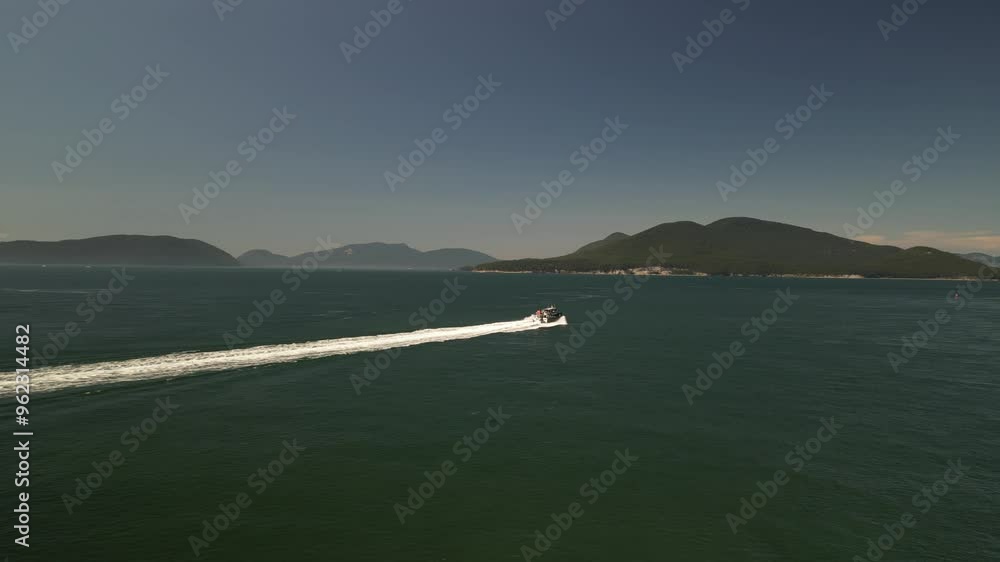 Aerial tracking boat off Anacortes Coasline in Pacific Ocean Aerial tracking boat off Anacortes Coasline in Pacific Ocean