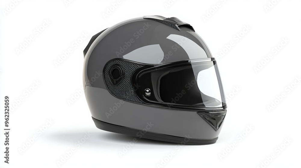 Gray motorcycle helmet isolated on white background. This helmet is designed to protect the head from impact in the event of a motorcycle accident. It has a hard outer shell made of fiberglass Gray motorcycle helmet isolated on white background. This helmet is designed to protect the head from impact in the event of a motorcycle accident. It has a hard outer shell made of fiberglass